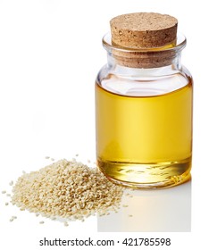 Bottle Of Sesame Oil And Sesame Seeds Isolated On White Background