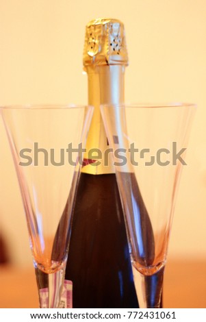 Bottle of shampagne and a pair glasses 
