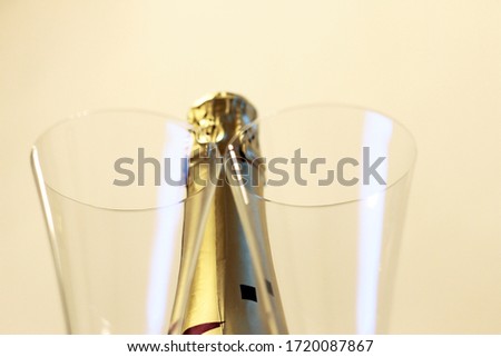 Bottle of shampagne and a pair glasses before drinking isolated on the white background