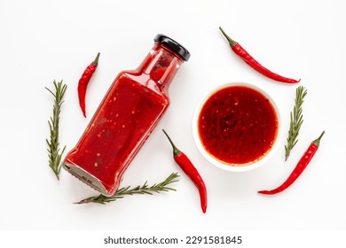 Bottle of spicy sauce tabasco with red hot chili pepper, top view.