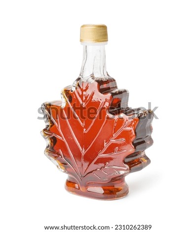 Bottle of sweet maple syrup isolated on white background