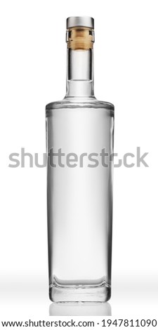 Bottle of transparent glass, with gin, tequila, rum or vodka, isolated on pure white background.