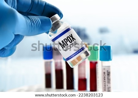Bottle of Vaccine for booster shot for Smallpox and Monkeypox MPXV. Doctor with vial of the doses vaccine for MPOX monkeypox disease