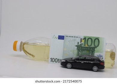 A Bottle Of Vegetable Oil And A Typewriter Lie On A Banknote. Biodiesel, Biofuel, Vegetable Oil, Fuel Crisis, Rising Fuel Prices, Biofuel Shortage