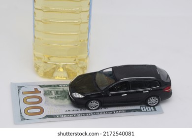 A Bottle Of Vegetable Oil And A Typewriter Lie On A Banknote. Biodiesel, Biofuel, Vegetable Oil, Fuel Crisis, Rising Fuel Prices, Biofuel Shortage