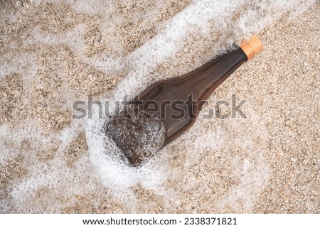 bottle washed up on the shore of a tropical beach