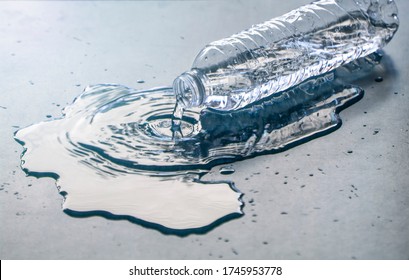 bottle of water spilled on the floor 
 - Powered by Shutterstock