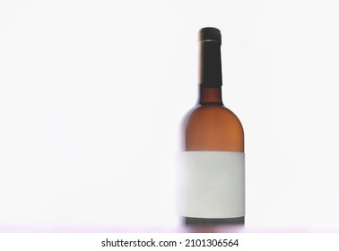 Bottle Of Wine With Blank Label. Unlabeled Wine Bottle. No Name Wine On White Background. Bottle Without A Name On The Label. Blank White Label. Back Lighting.