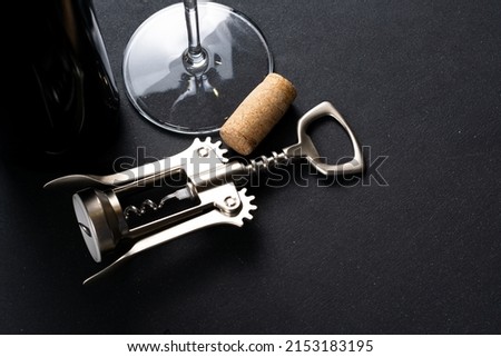 Bottle of Wine and corkscrew