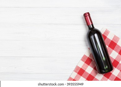 Bottle Of Wine On The White Table With The Red Napkin.