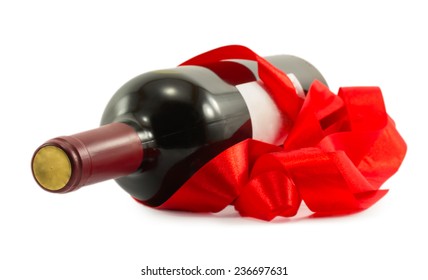 bottle of wine with red ribbon isolated on white background - Shutterstock ID 236697631