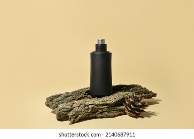 Bottle Of Woody Perfume On Light Color Background