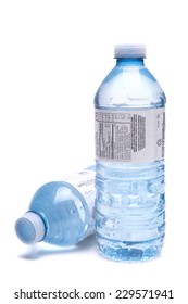 Bottled water close up shot isolated on the white background, shallow focus