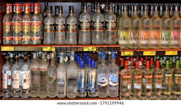 Bottles with alcohol on\
shelves. Vodka. Store. Shopping Mall. Smirnoff, Belvedere, Russian\
Standard vodka, Premium vodka. merchandise.  Ghana, Accra - January\
20, 2017