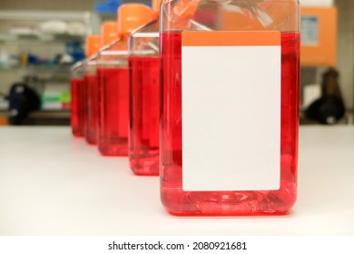 Bottles With Cell Culture Medium With White Clear Label