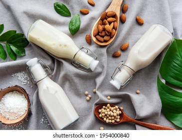 Bottles With Different Plant Milk - Soy, Almond And Oat Milk.