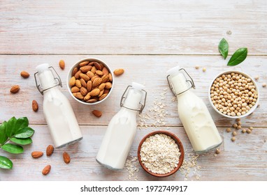 Bottles With Different Plant Milk - Soy, Almond And Oat Milk.