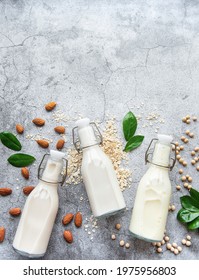 Bottles With Different Plant Milk - Soy, Almond And Oat Milk.