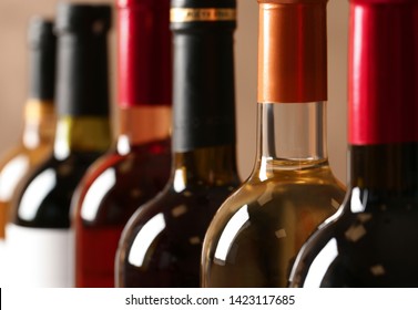 Bottles of different wines, closeup. Expensive collection