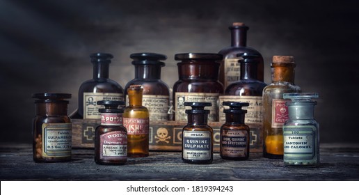 Bottles With Drugs From Old Medical, Chemical And Pharmaceutical Glass. Chemistry And Pharmacy History Concept Background. . Medical  Substances- Sulfamerazin, Arsenic Trioxid, Quinine Sulphate Etc.