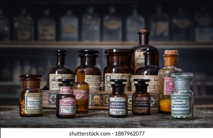 Bottles With Drugs From Old Medical, Chemical And Pharmaceutical Glass. Chemistry And Pharmacy History Concept Background. Retro Style. Chemical Substances-sulfamerazin, Arsenic Trioxid Etc.