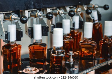 Bottles Of Expensive Cognac Stand On Production Line In Shop