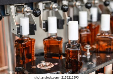 Bottles Of Expensive Cognac Stand On Production Line In Shop