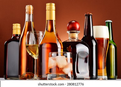 Bottles and glasses of assorted alcoholic beverages.