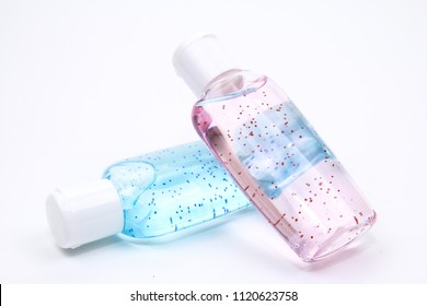 Bottles of lotion containing beads of microplastics. Microplastics are environmentally harmful and have been banned from use in some countries.