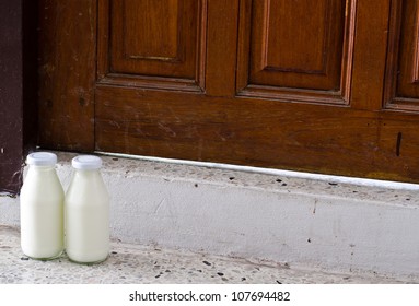 Bottles Of Milk On A Doorstep