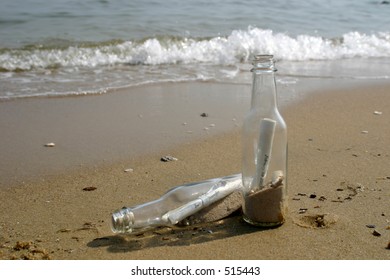 bottles on a beach - Shutterstock ID 515443