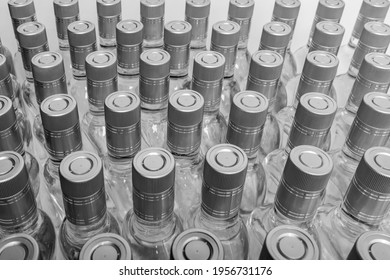Bottles of pure alcohol not labeled. Multitude Bottles of Home Alcoholic Beverages Isolated On White. Small liquor production based on distillation. Bottles empty full  placed in a row.  