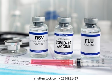 Bottles of vaccine for Influenza Virus, Respiratory Syncytial virus and Covid-19 for vaccination. Flu, RSV and Sars-cov-2 Coronavirus vaccine vials in the medical clinic - Shutterstock ID 2234921417