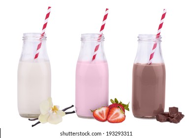 Bottles Of Vanilla, Chocolate, And Strawberry Milk 