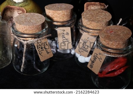 Bottles with various objects inside, fantasy based for alchemy or an apothecary