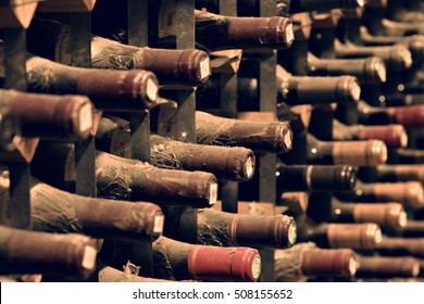 Bottles of wine aging in an underground cellar