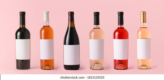 Bottles Of Wine With Blank Labels On Color Background. Mockup For Design