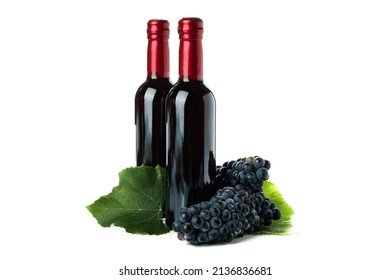 Bottles of wine and grape isolated on white background