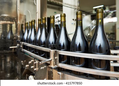 Bottling And Sealing Conveyor Line At Winery Factory