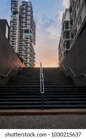 Bottom angle view of staircase with ray of sun.