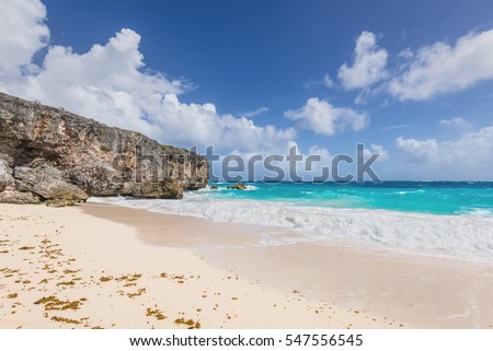 Bottom Bay is one of the most beautiful beaches on the Caribbean island of Barbados. It is a tropical paradise with palms hanging over turquoise sea and a pirate cave.