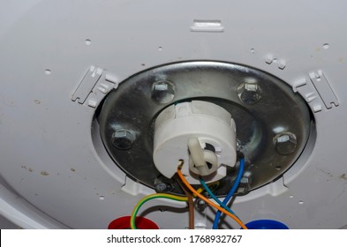 Bottom Of The Outboard Water Heater Before Disassembling. Leaking Home Boiler. Repair And Maintenance Of Household Appliances. Selective Focus.