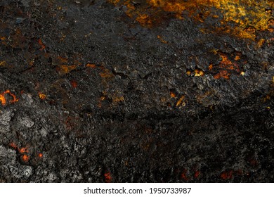 Bottom Side Of A Cast Iron Pan With Thicl Layer Of Soot On It.