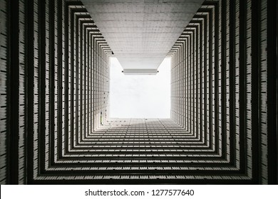 Bottom View Of Abstract Tunnel Corridor Stack Building With Symmetry Layer.