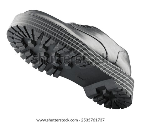 Bottom view of black leather boot isolated on white background. Low tops high sole shoe with clipping path. Full Depth of Field