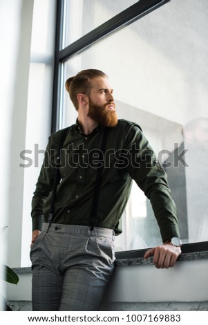 bottom view of businessman standing and looking at window Stock photo © 