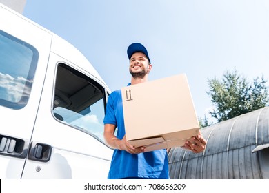 Bottom View Of Delivery Man With Cardboard Box