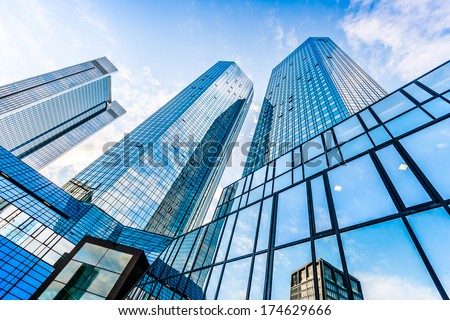 Bottom view of Deutsche Bank Twin Towers in the central business district of Frankfurt am Main, Germany. Frankfurt is the largest financial centre in Europe.