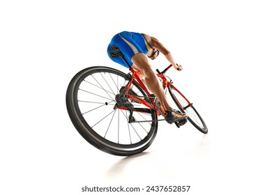 Bottom view dynamic image of man, athlete, cyclist in motion riding on bike isolated on white studio background. Concept of sport, active and healthy lifestyle, speed, endurance, hobby