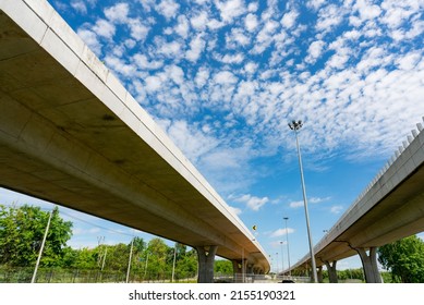 Bottom view of elevated concrete highway. Overpass concrete road. Strong structure of cement bridge. Concrete bridge engineering construction. Bridge architecture. Infrastructure budget policy concept - Shutterstock ID 2155190321